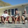 Andy, Chris and Kris on the deck of the Big Beach House at Tora for Kris's 50th
